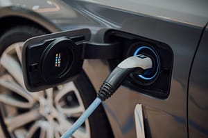 Electric vehicle currently charging. Photo by CHUTTERSNAP on Unsplash